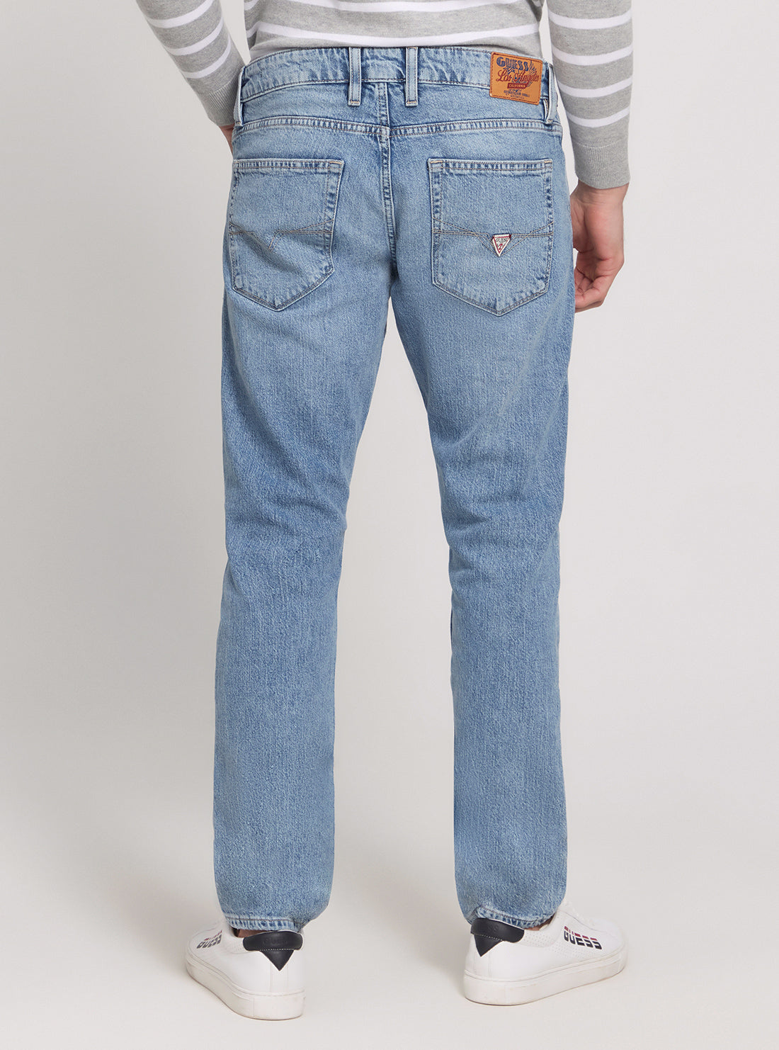 GUESS Low Rise Slim Tapered Denim Jeans in Light Wash back view