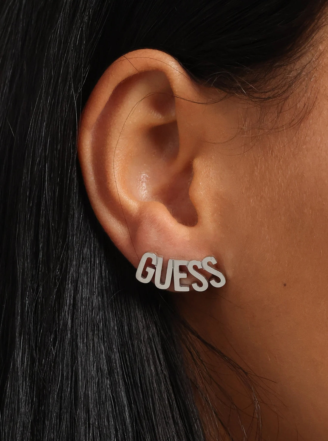 GUESS Womens Silver GUESS Script Stud Earrings UBE20000SLV Model View
