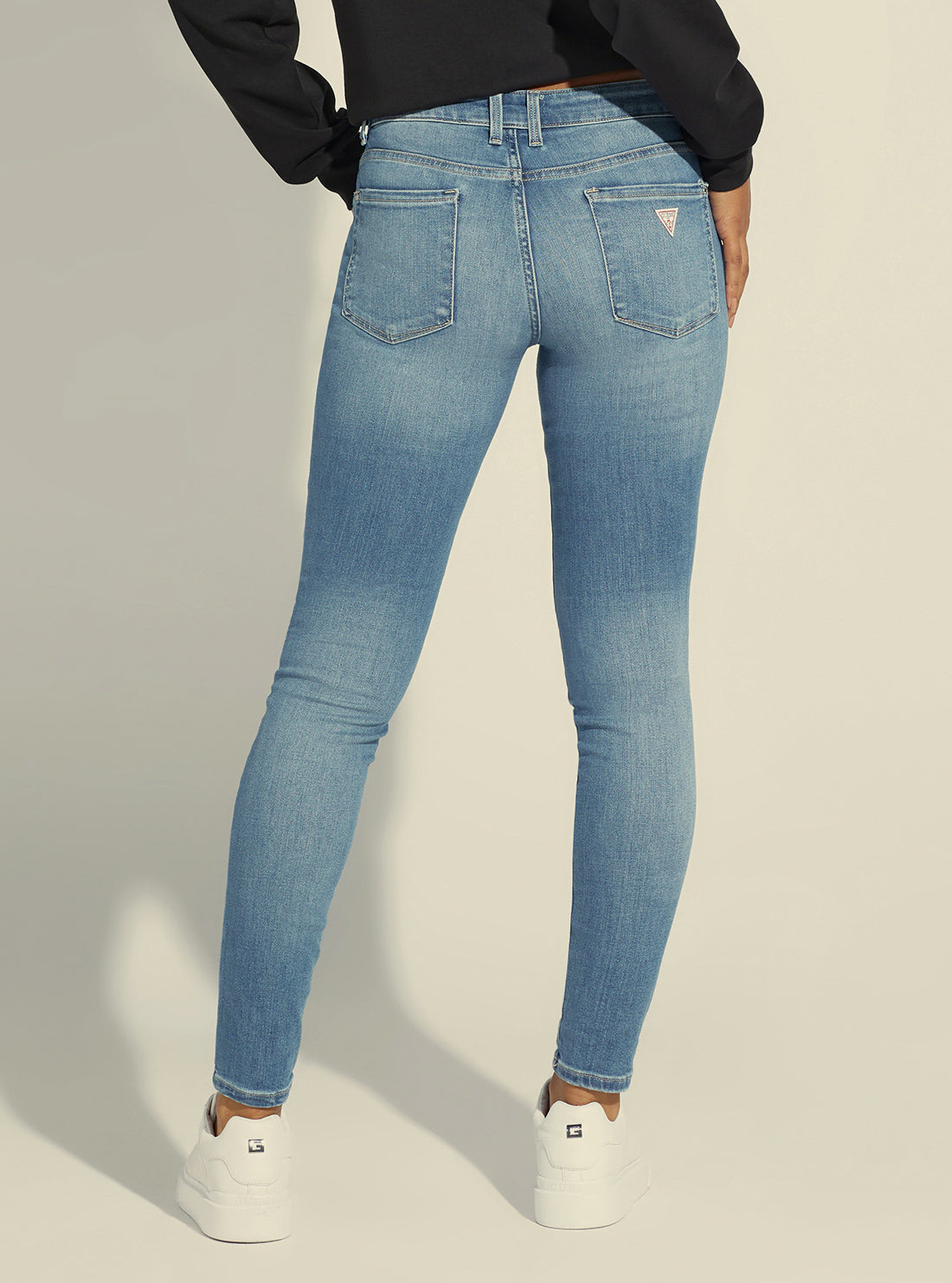 guess womens Annette Mid-Rise Skinny Denim Jeans in Carrie Light Wash back view