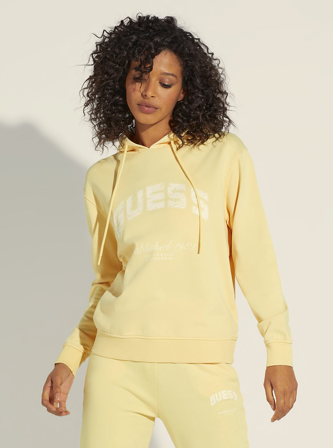 GUESS Women's Yellow Bryony Active Logo Hoodie Jumper V2YQ02FL04D Pose View